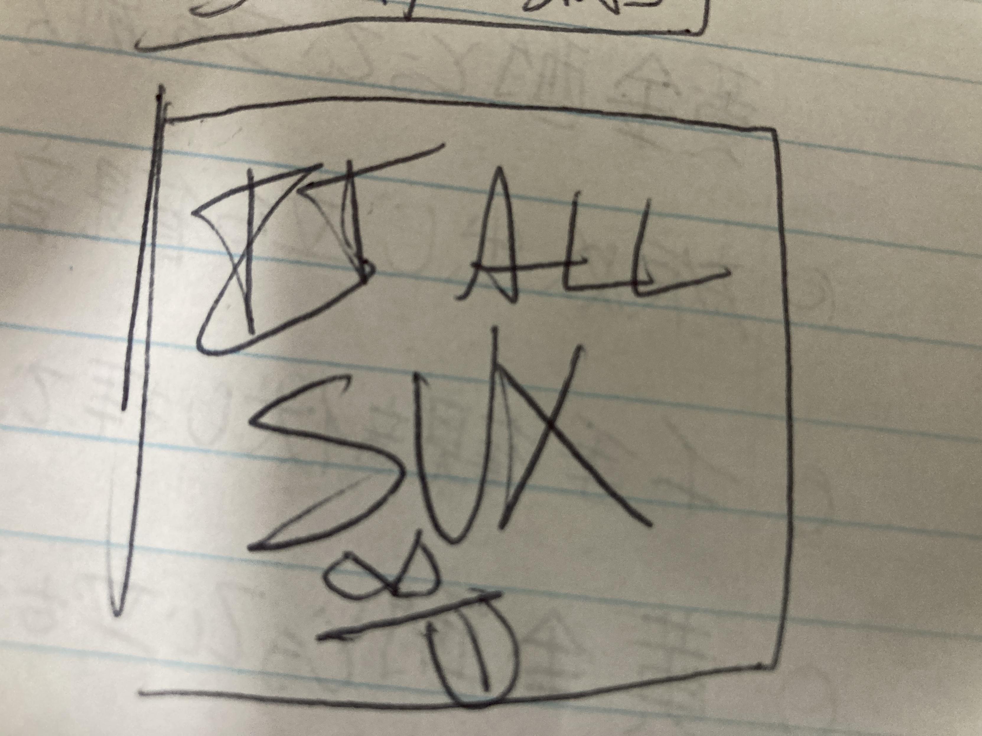 It all sux, in caps, with a lil aggro face sticking out its tongue.